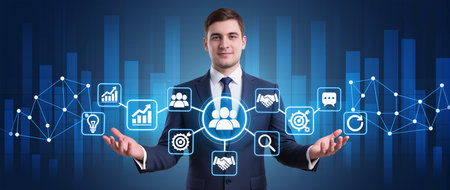 Businessman in front of a virtual screen with business icons and graphsの素材