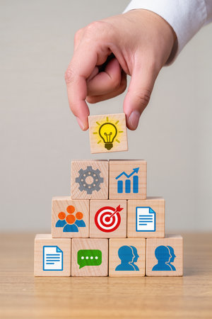 Wooden block stacking as step stair with business icon on wooden background, business growth conceptの素材