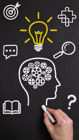 Human head with gears and lightbulb on blackboard. Brainstorming conceptの素材