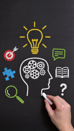 Man drawing a blackboard with a chalk and a business idea conceptの素材