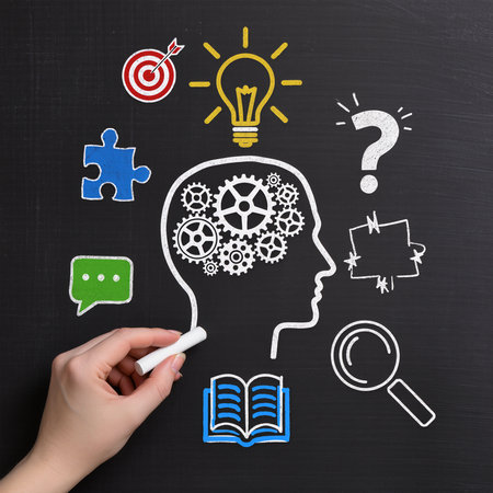 business and education concept, human head with gears and icons on blackboardの素材