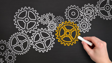 Hand drawing gear wheels on blackboard with white chalk 3D renderingの素材