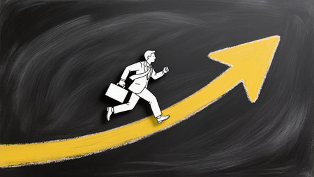 Businessman running on a yellow arrow drawn on a blackboard.の素材