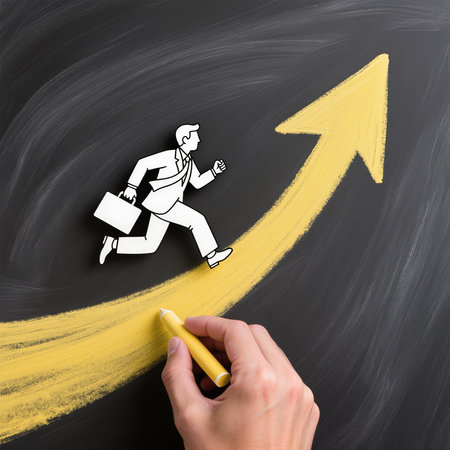 Businessman running on a yellow arrow drawn on a blackboard.の素材