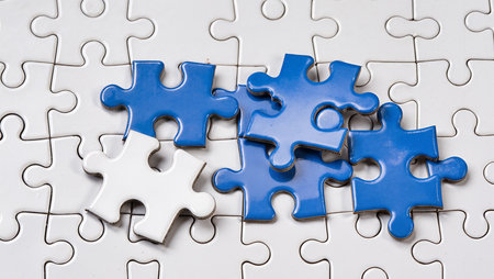 Missing jigsaw puzzle pieces on white background, business concept image.の素材