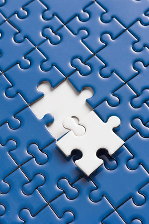 Piece missing from jigsaw puzzle - business concept image. Blue backgroundの素材