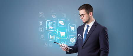 Businessman holding tablet with online shopping icons and symbols concept on backgroundの素材