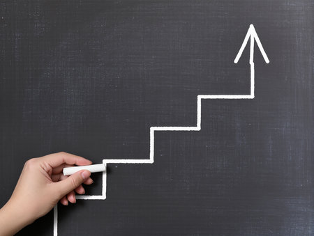 drawing a chart on a blackboard as a symbol of successの素材