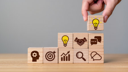 Wooden blocks with icons of business, technology, internet and networking concept.の素材