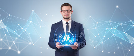 Businessman holding a cloud computing concept on a touch screen with his fingersの素材