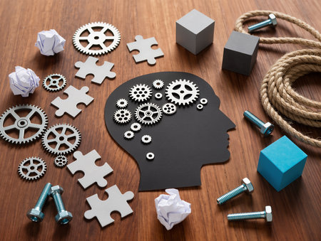 Human head with gears and cogwheels on a wooden background.の素材