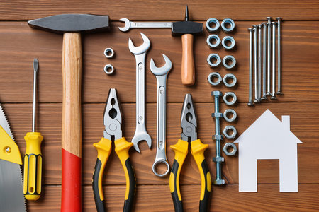 Variety of tools on wooden background, top view. House repairの素材