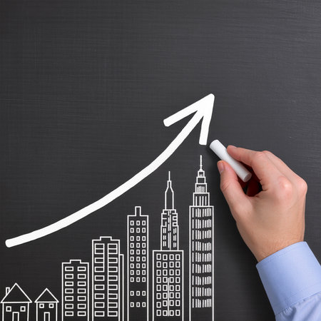 hand drawing a graph on a blackboard, concept of business growthの素材