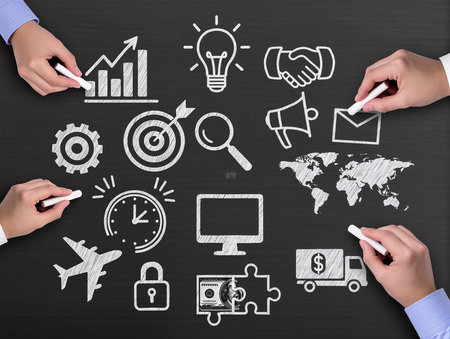 business hand drawing business strategy concept on blackboard with chalk and iconsの素材