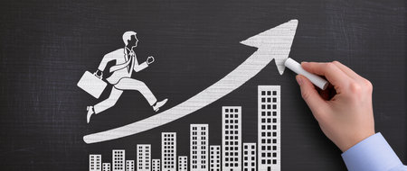 Businessman drawing growth graph on blackboard, business and finance conceptの素材