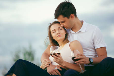 Young happy couple kiss on seashoreの写真素材