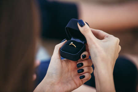 close up woman hands opening engagment ring box. Love, Wedding, Proposing, Marriage concept.の写真素材