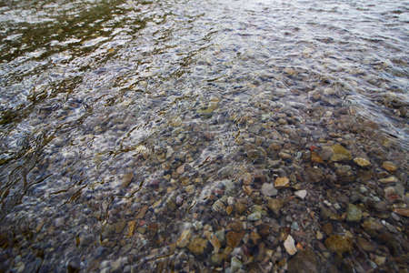 Transparent water on the stones. Cloudy dayの写真素材