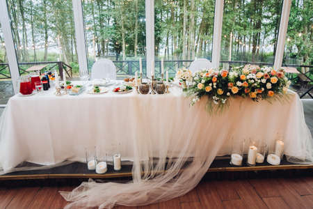 Wonderful magical interior of table for newlyweds table in rustic style with natural decor.の写真素材