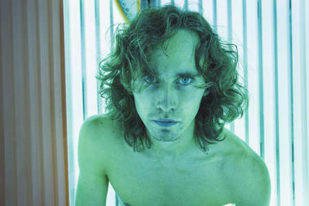 Young Thin Man At Solarium In Beauty Salon.の写真素材
