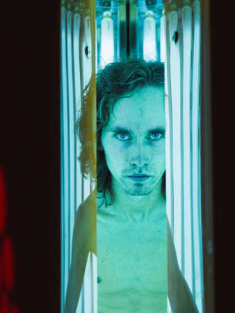 Young Thin Man At Solarium In Beauty Salon.の写真素材