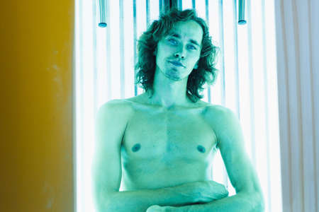 Young Thin Man At Solarium In Beauty Salon.の写真素材