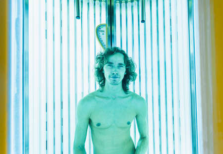 Young Thin Man At Solarium In Beauty Salon.の写真素材