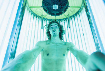 Young Thin Man At Solarium In Beauty Salon.の写真素材