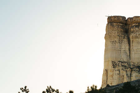 View of White rock or Aq Qaya on a Sunny summer day on sunset. Crimea. White limestone with a...