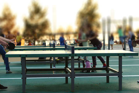 Blue ping pong table outdoors. Table tennis equipment in park. Side view, product displayの写真素材