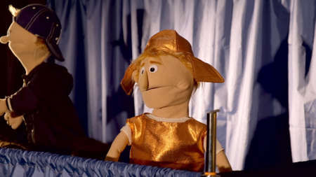 Puppet Roman soldier in action. In the background there is the other puppet characterの写真素材