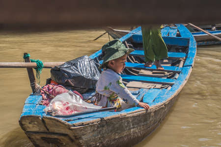 Traditional Vietnamese ferry boat taking people and their bicycles across the Mekong River in Vietnam, South East Asia. Vung Tau, Vietnam - FEBRUARY 28, 2020のeditorial素材