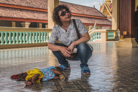 Sleeping Child On A Floor Of The Royal Palace. Phnom Penh, Cambodia - FEBRUARY 22, 2020のeditorial素材