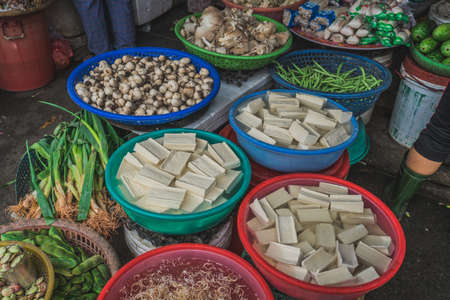 Different vegetables and tofu at a street market in asia. Hoi An, Vietnamの写真素材