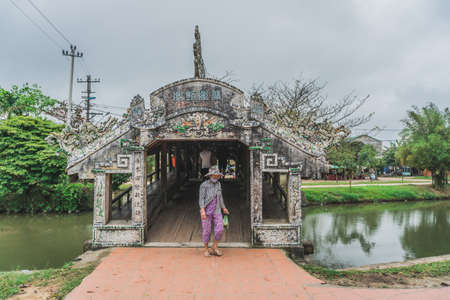 Old river bridge in Vietnamese village. Hue, Vietnam - March 9, 2020.のeditorial素材