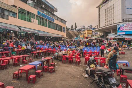 People buy and sell seafood and vegetable on the street food market in Asia. Dalat, Vietnam - March 17, 2020のeditorial素材