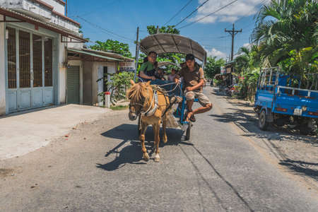 Rural Horse cart with tourist in a Vietnamese countryside. Vietnam, Mekong Delta, 20 March 2020.のeditorial素材