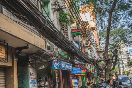Power lines electric cables in the city streets. Ho Chi Minh, Vietnam - March 19, 2020のeditorial素材