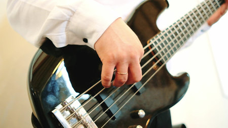 Guitarist playing of guitar. Close up shot.の写真素材
