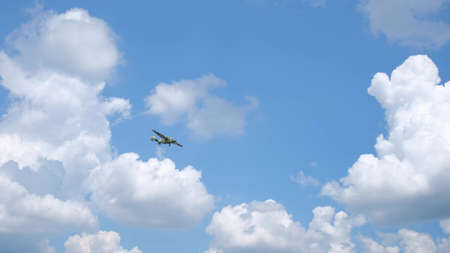 Military aircraft flying through the sky. Sunny weather.の写真素材