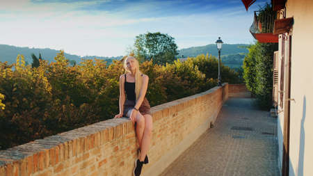 Gorgeous blonde woman enjoying the sun rays in summer. Vacation in the south.の写真素材