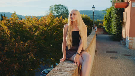 Blonde woman relaxing and smiling. Natural beauty. Having fun on summer time.の写真素材