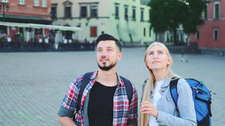 Two tourists with map looking for new historical place in city center. They finding something interesting.の写真素材