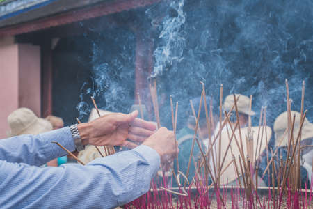 Candle smoke in a temple in Vietnam Asiaの写真素材