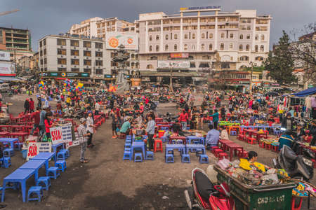 People buy and sell seafood and vegetable on the street food market in Asia. Dalat, Vietnam - March 17, 2020のeditorial素材