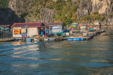 Floating Fishing Village In The Ha Long Bay. Cat Ba Island, Vietnam Asia. Cat Ba, Vietnam - March 5, 2020.のeditorial素材