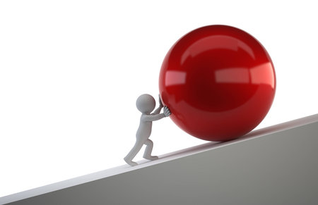 little man pushing a ball uphill, Isolated white backgroundの写真素材