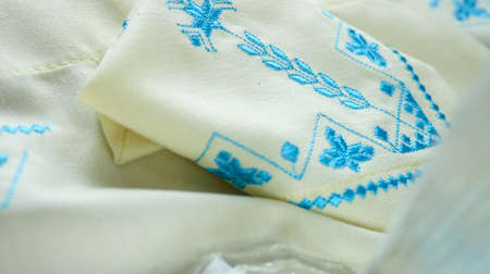 blue embroidery on white kitchen towel