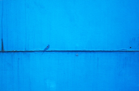 blue wall front of factoryの写真素材