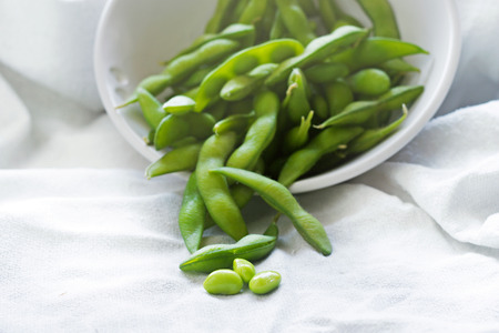 boiled green soybeans on fabric backgroundの写真素材